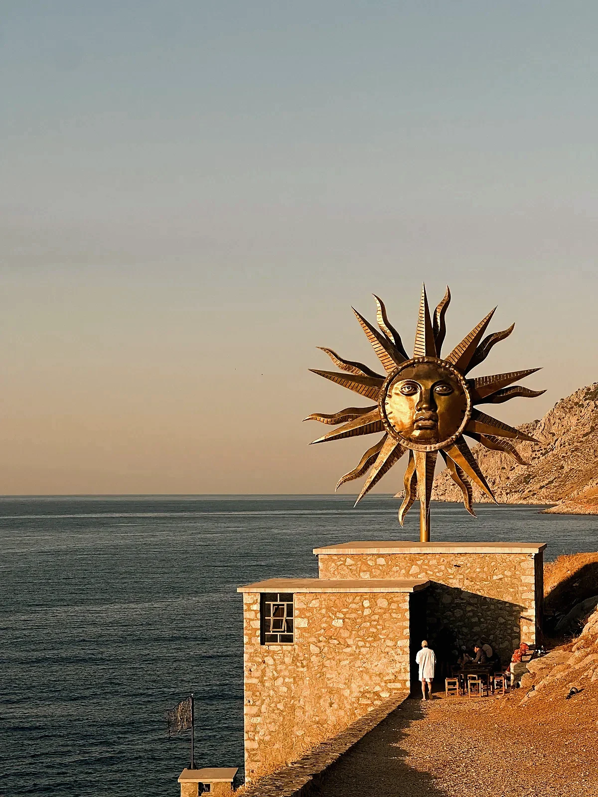 Hydra brass sun sculpture overlooking the harbor