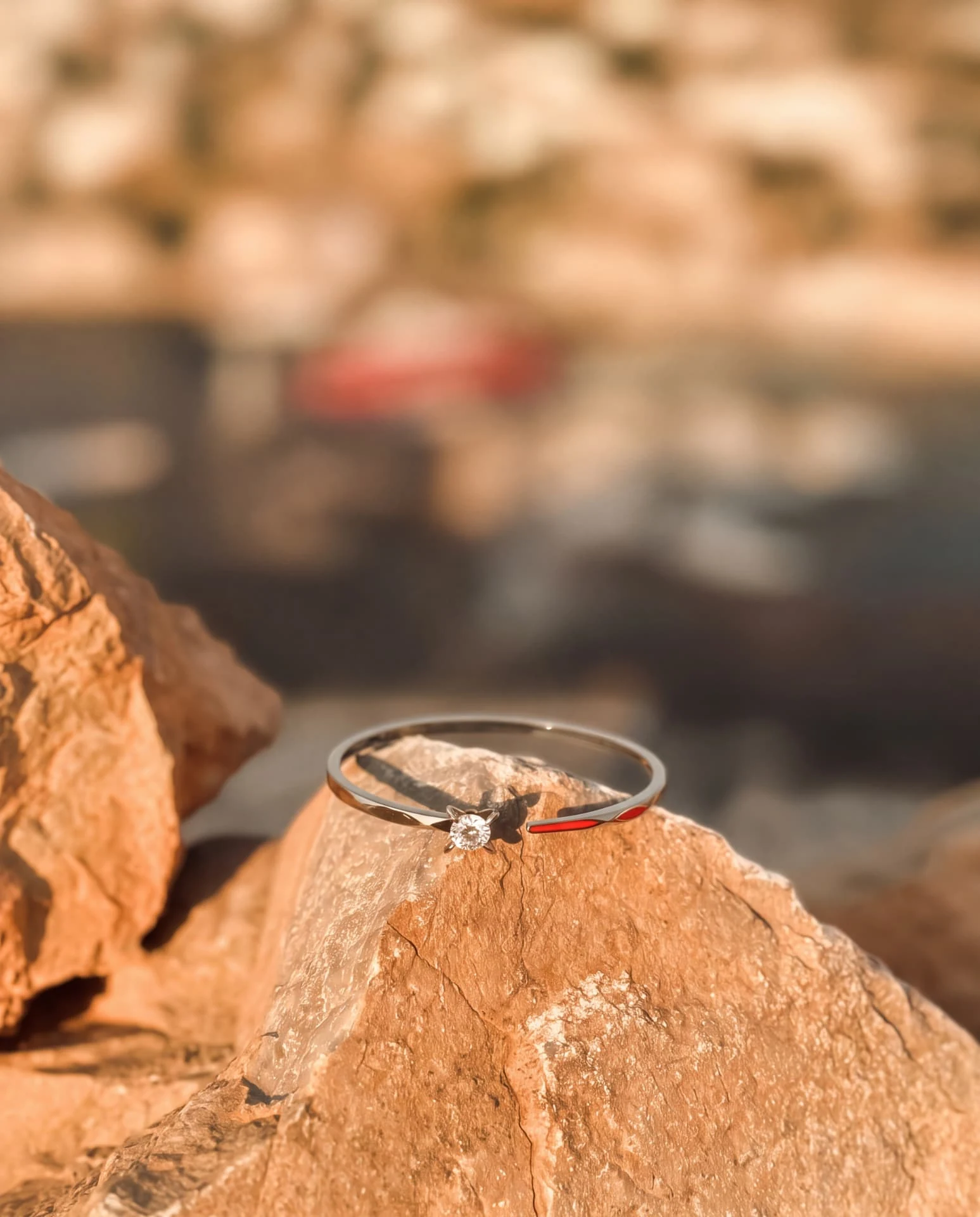 Solera diamond ring resting on sunlit Hydra stone